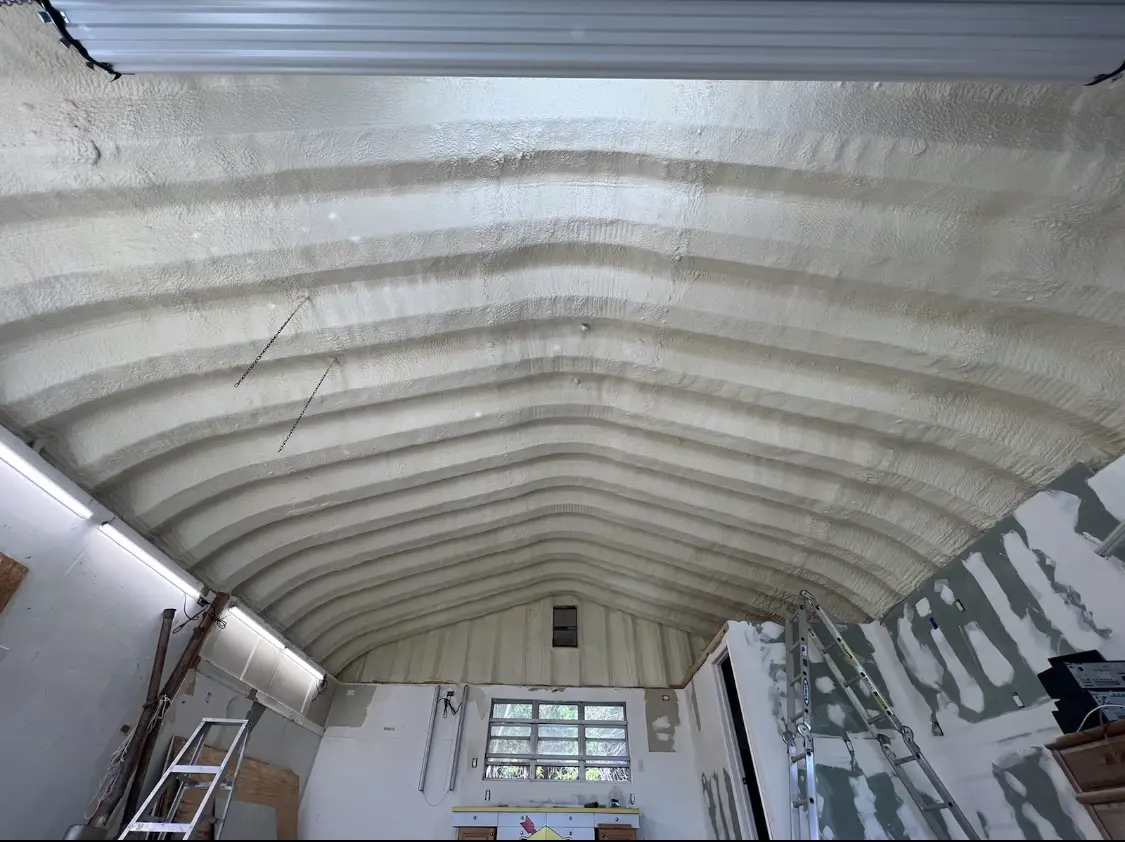 Spray polyurethane foam applied to the underside of a metal roof deck in Carpinteria